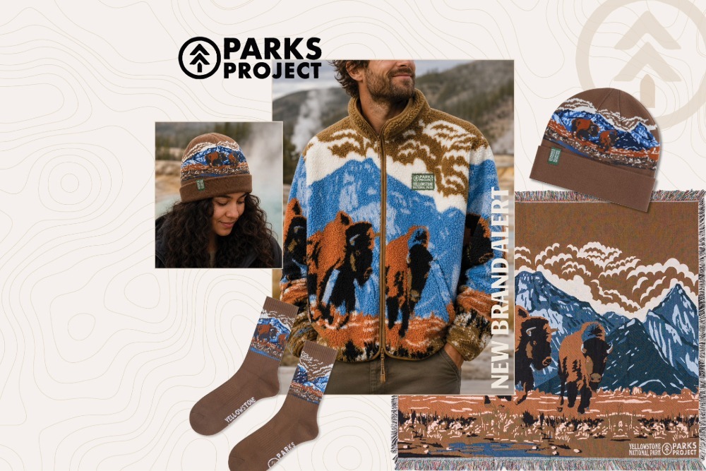 Woman in beanie, man in fleece jacket, socks, and a blanket all featuring buffalo in Yellowstone National Park.